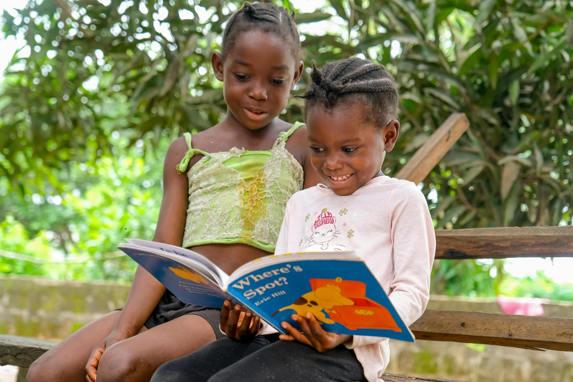 Jamaican schoolchildren absorbed in reading picture books
