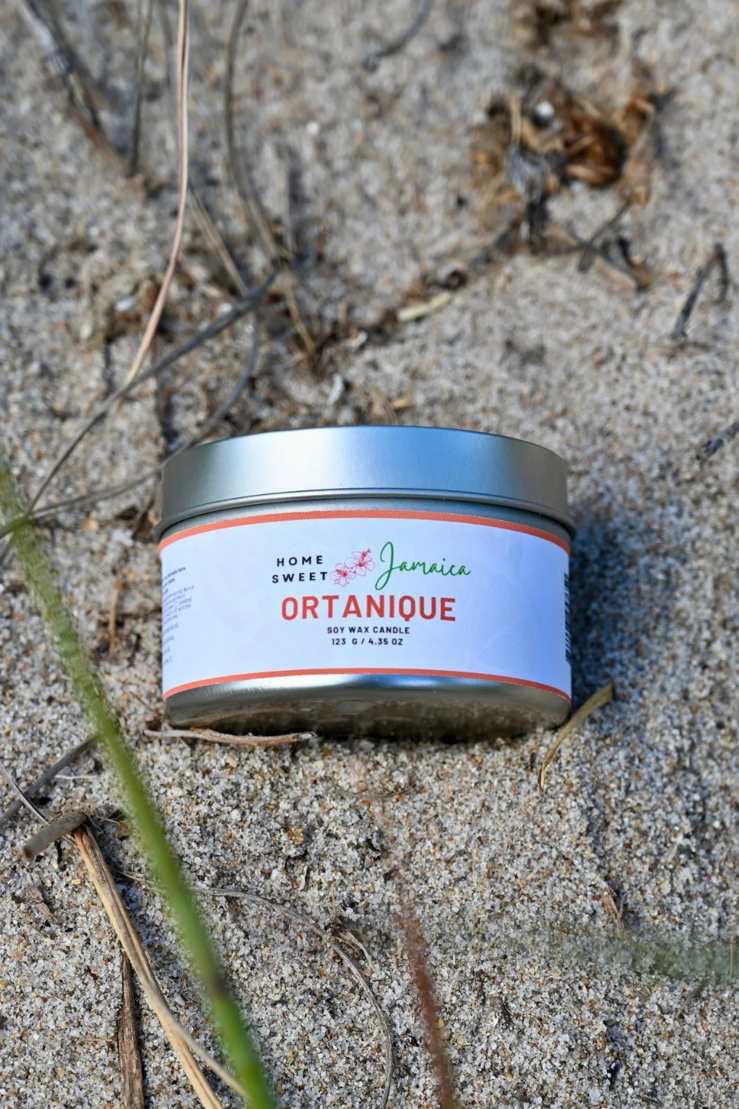 Ortanique candle on beach